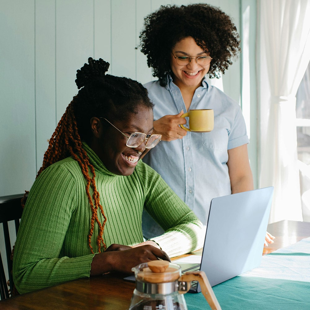 Two women evaluating Bloomerang nonprofit software